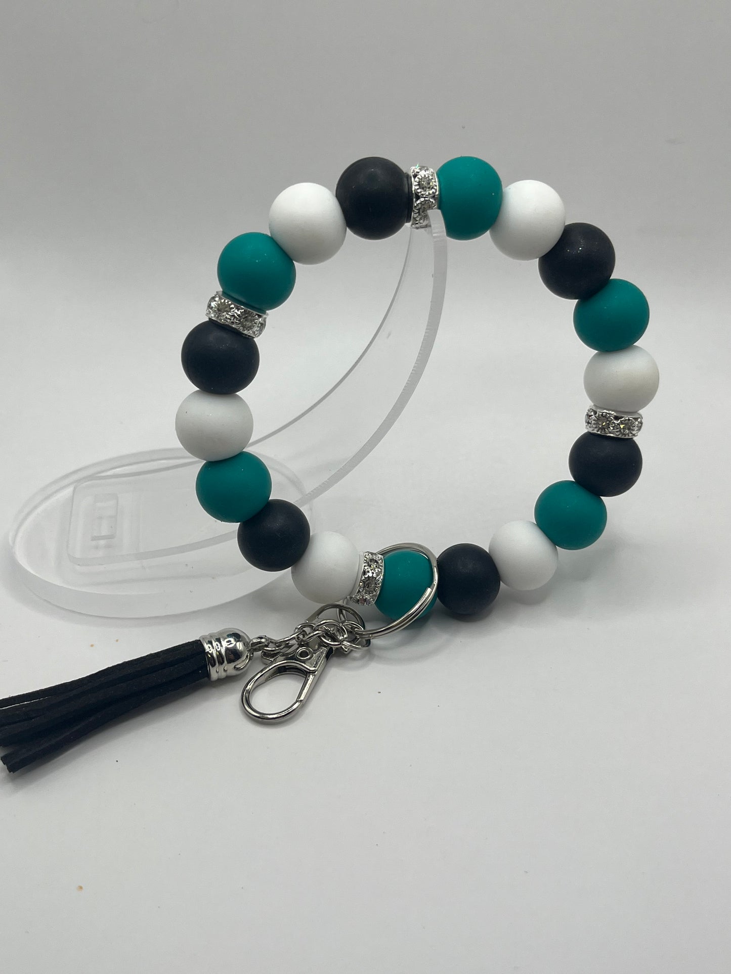 Teal, black and white wristlet